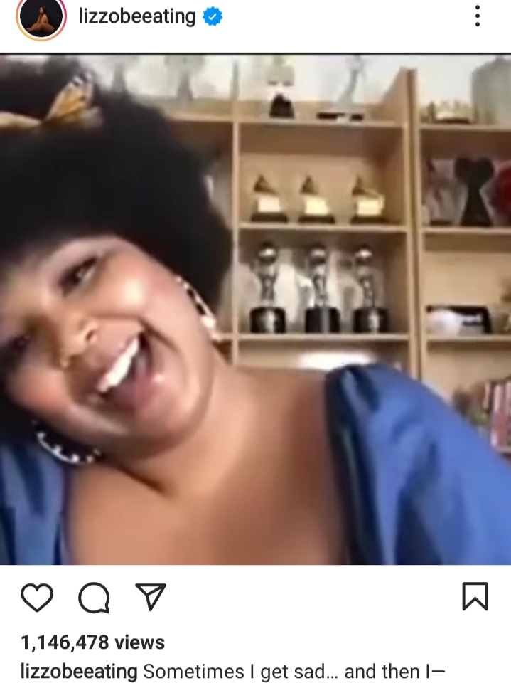 A snippet from the video where Lizzo B is seen showing her Grammy's to overcome sadness